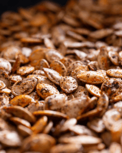 Roasted pumpkin seeds covered in spices.