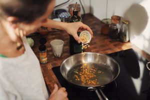 woman, cooking, silver pan, kitchen